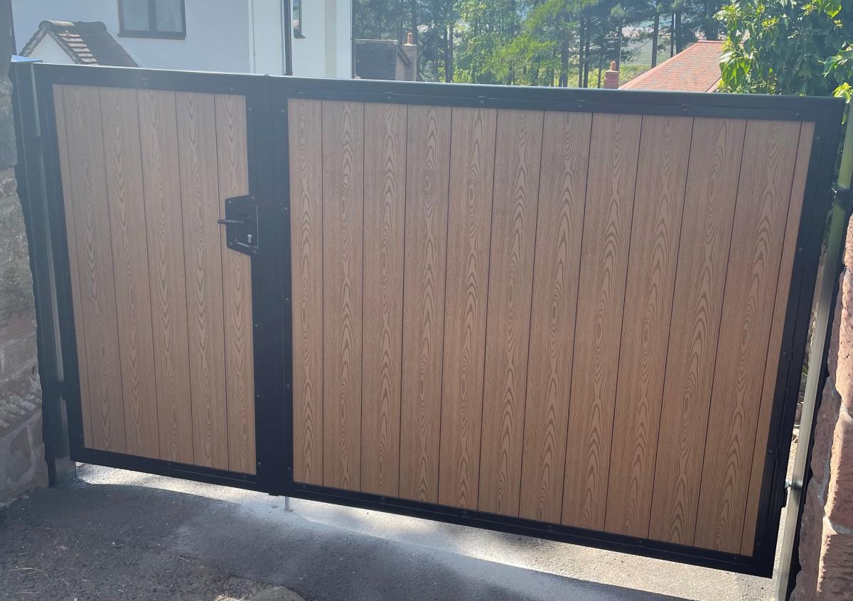 One and two thirds double composite gates in golden oak style fitted at a property in the Liverpool area.