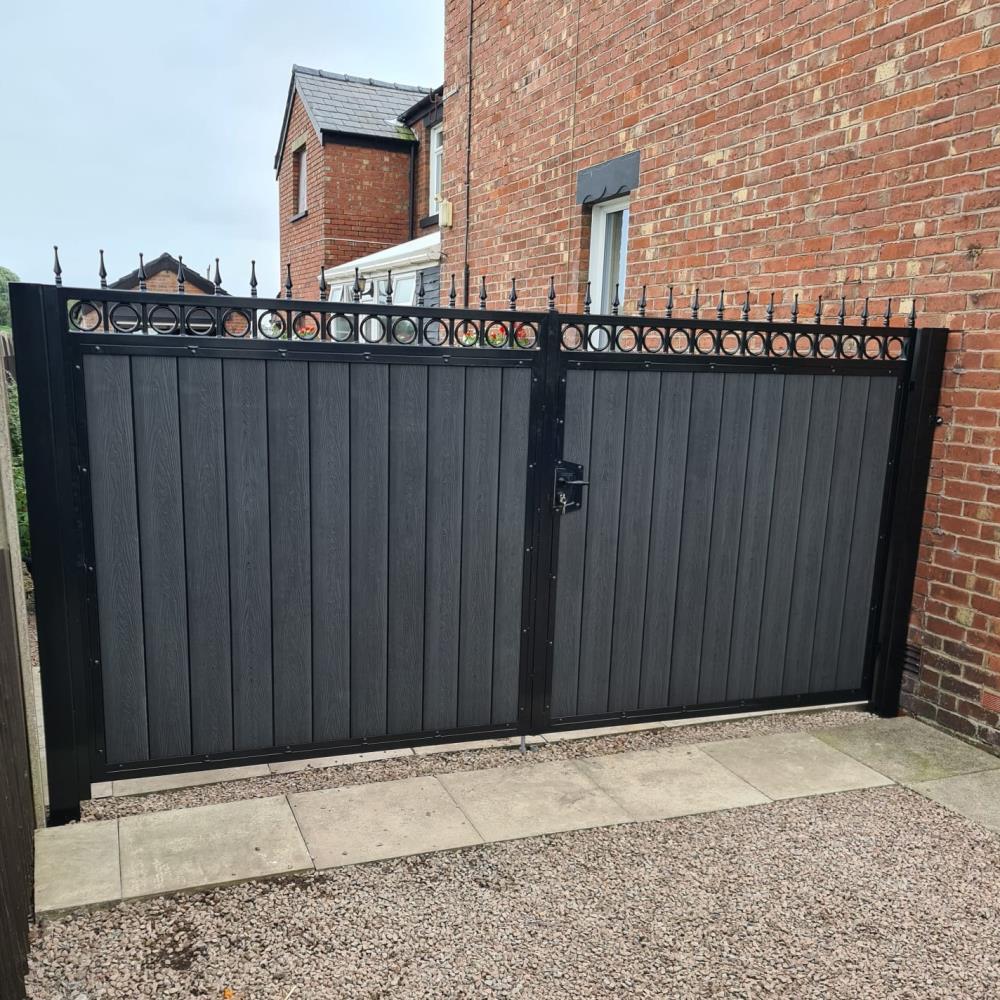 Ornate steel gates with black embossed composite fitted in Hesketh Bank, Lancashire.