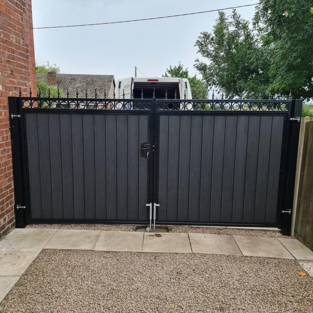 Rear view of composite gates with an ornate steel frame for a Lancashire home.